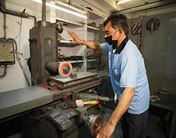 An Employee working on trolly wheels, caster wheels, rubber trolly wheels machine
